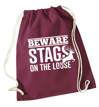 Beware stags on the loose maroon drawstring bag