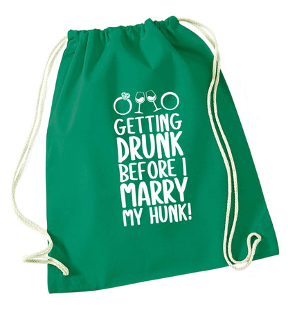 Getting drunk before I marry my hunk green drawstring bag