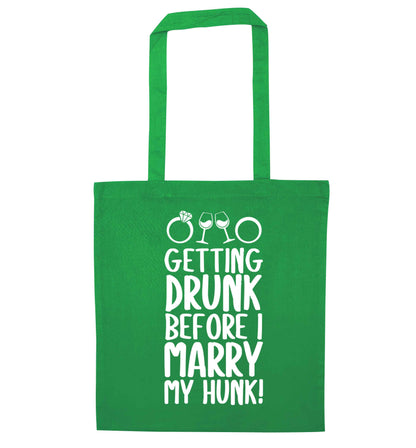 Getting drunk before I marry my hunk green tote bag