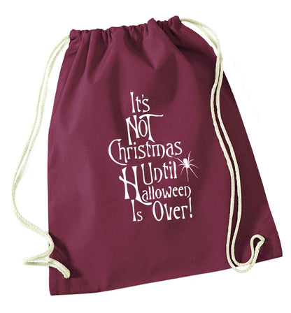 It's not Christmas until Halloween is over maroon drawstring bag