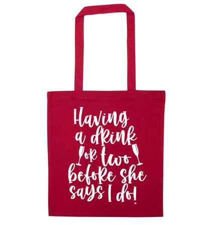 Having a drink or two before she says I do red tote bag