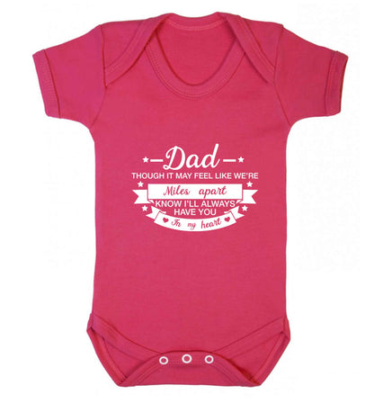 Dad though it may feel like we're miles apart know I'll always have you in my heart baby vest dark pink 18-24 months