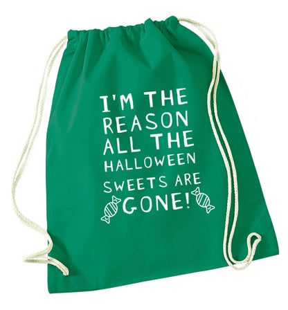 I'm the reason all of the halloween sweets are gone green drawstring bag
