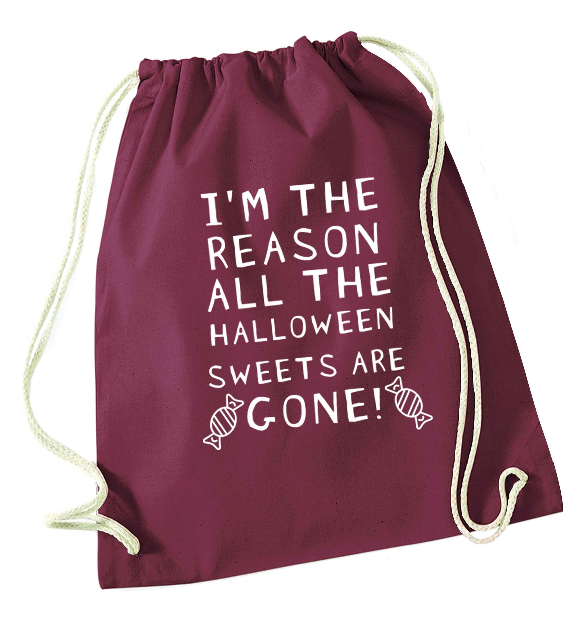 I'm the reason all of the halloween sweets are gone maroon drawstring bag