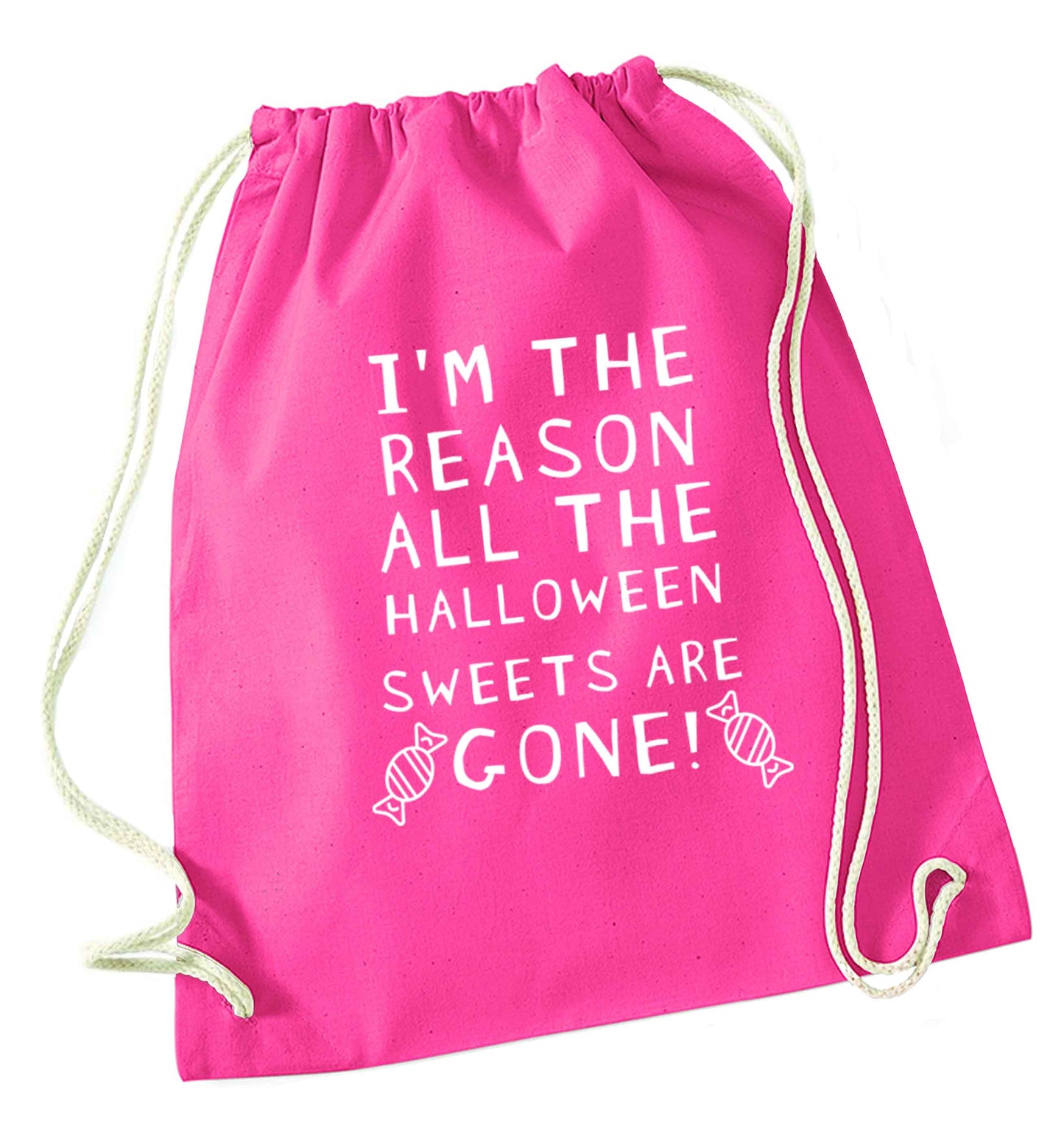 I'm the reason all of the halloween sweets are gone pink drawstring bag