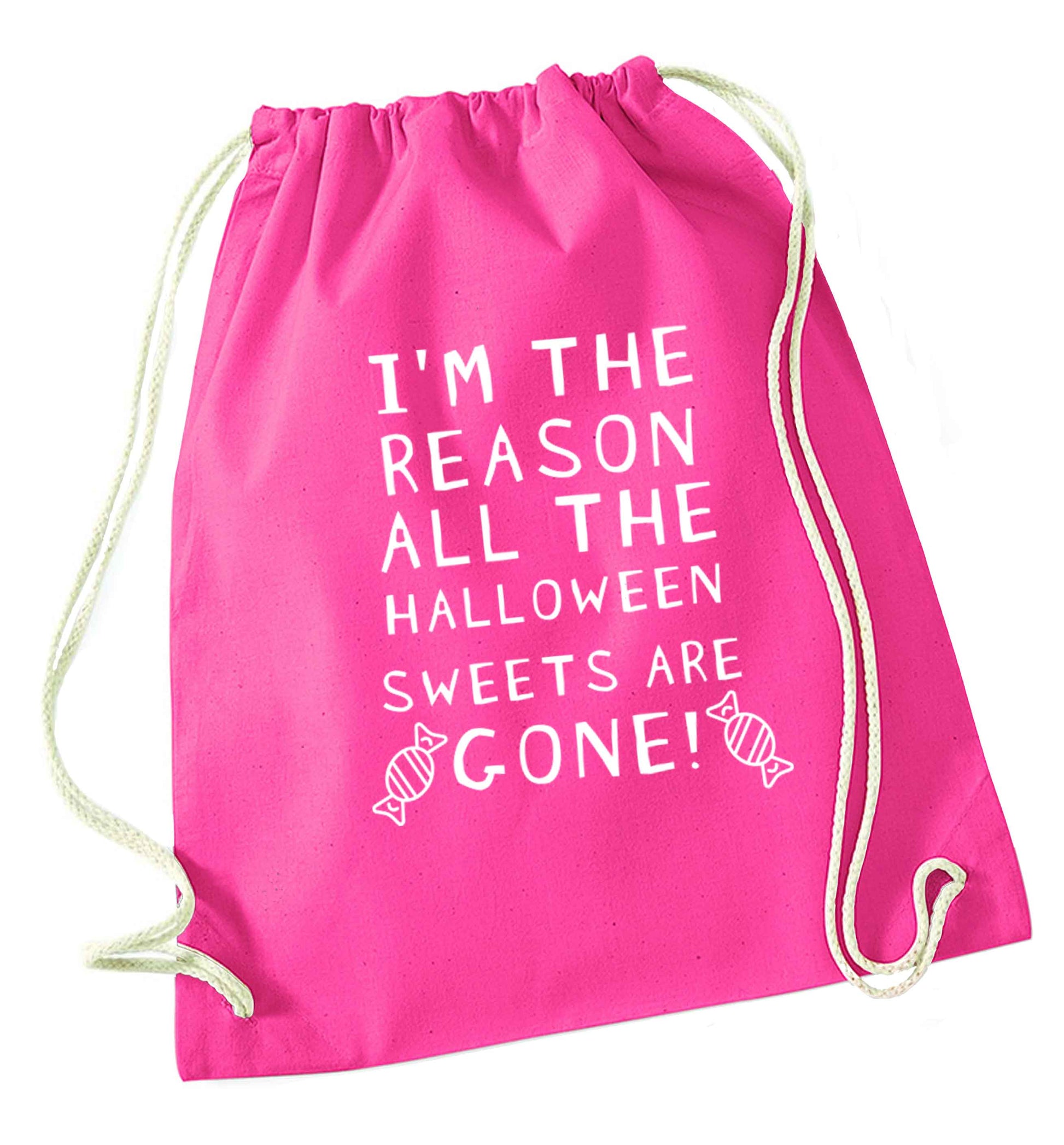 I'm the reason all of the halloween sweets are gone pink drawstring bag