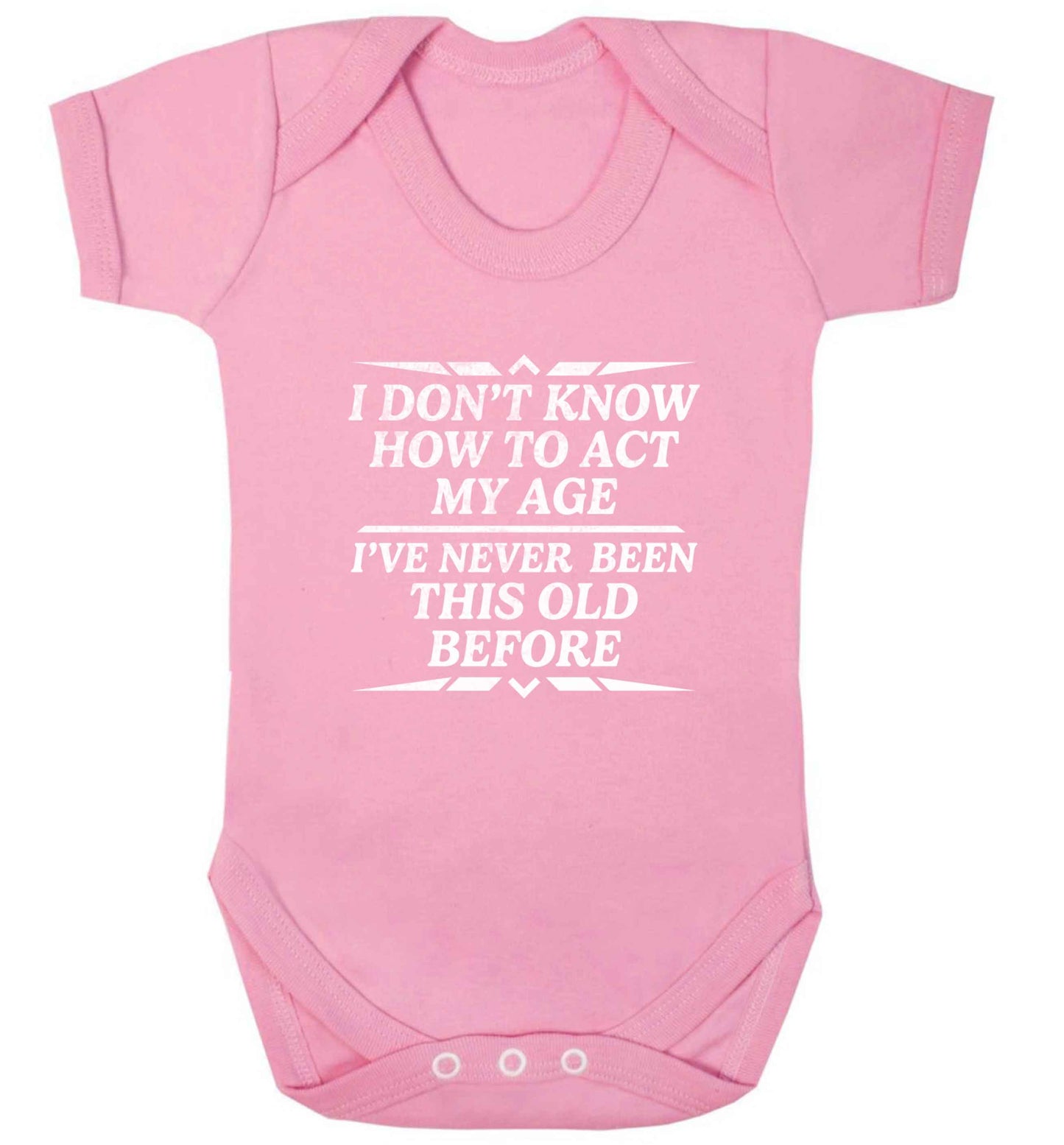 I don't know how to act my age I've never been this old before baby vest pale pink 18-24 months