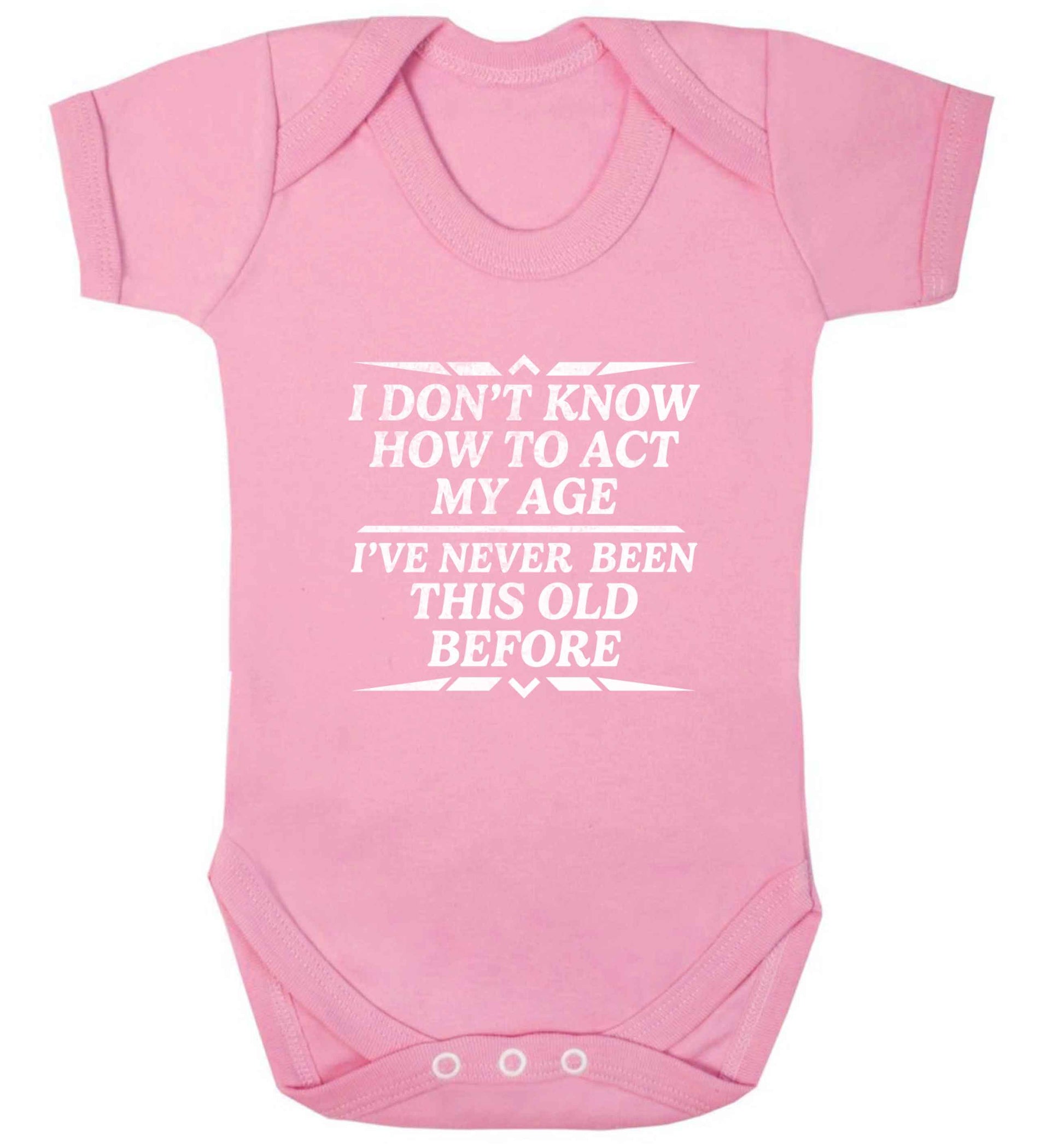 I don't know how to act my age I've never been this old before baby vest pale pink 18-24 months
