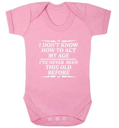 I don't know how to act my age I've never been this old before baby vest pale pink 18-24 months