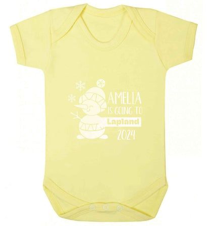 Any name here - is going to Lapland personalised baby vest pale yellow 18-24 months