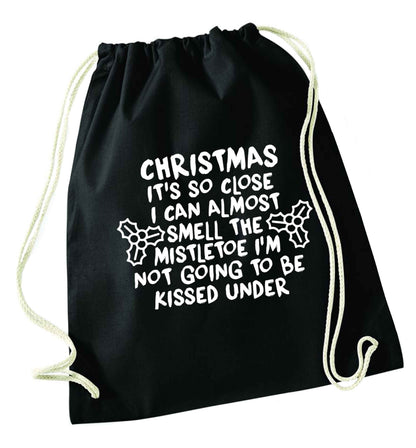 Christmas it's so close I can almost smell the misteltoe I'm not going to be kissed under black drawstring bag