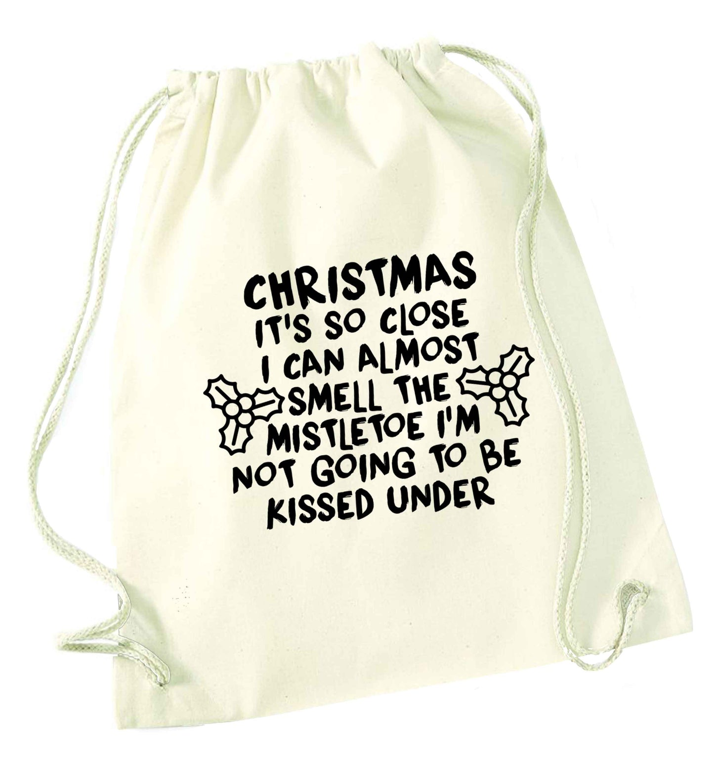 Christmas it's so close I can almost smell the misteltoe I'm not going to be kissed under natural drawstring bag