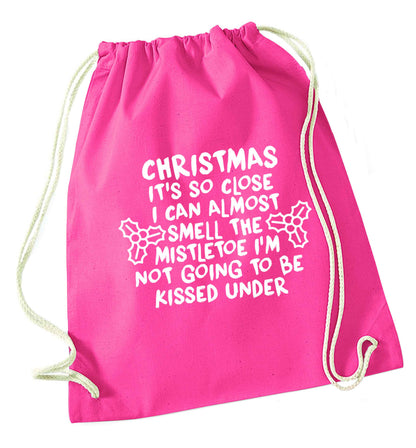 Christmas it's so close I can almost smell the misteltoe I'm not going to be kissed under pink drawstring bag