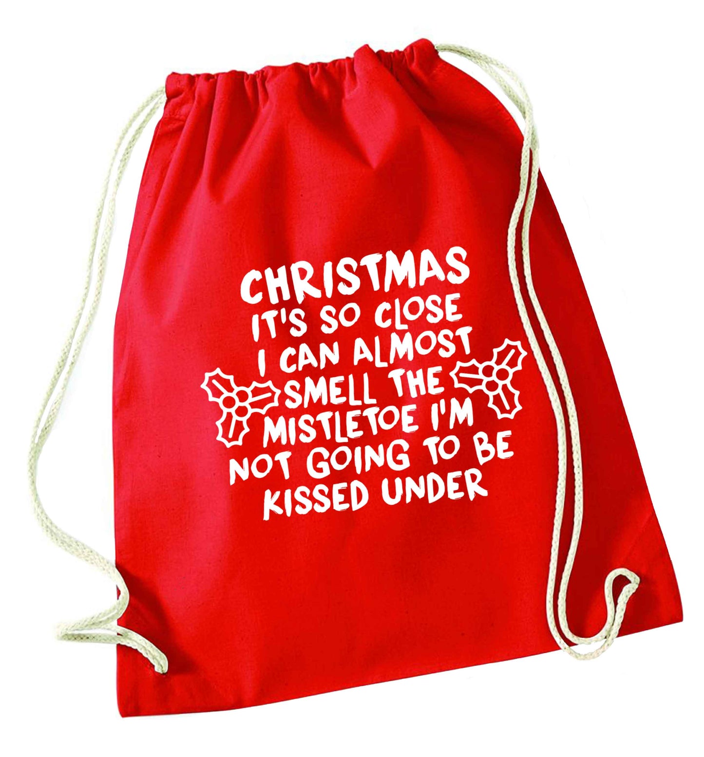 Christmas it's so close I can almost smell the misteltoe I'm not going to be kissed under red drawstring bag 
