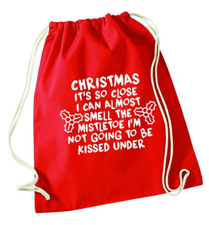 Christmas it's so close I can almost smell the misteltoe I'm not going to be kissed under red drawstring bag 
