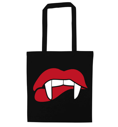 Vampire fangs black tote bag