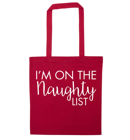 I'm on the naughty list red tote bag